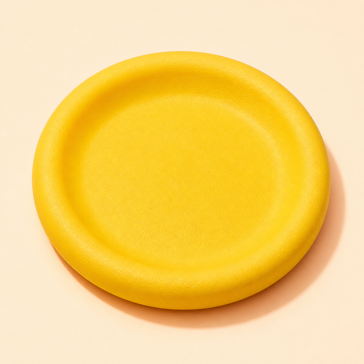 Yellow EVA flying disc, unbranded studio view